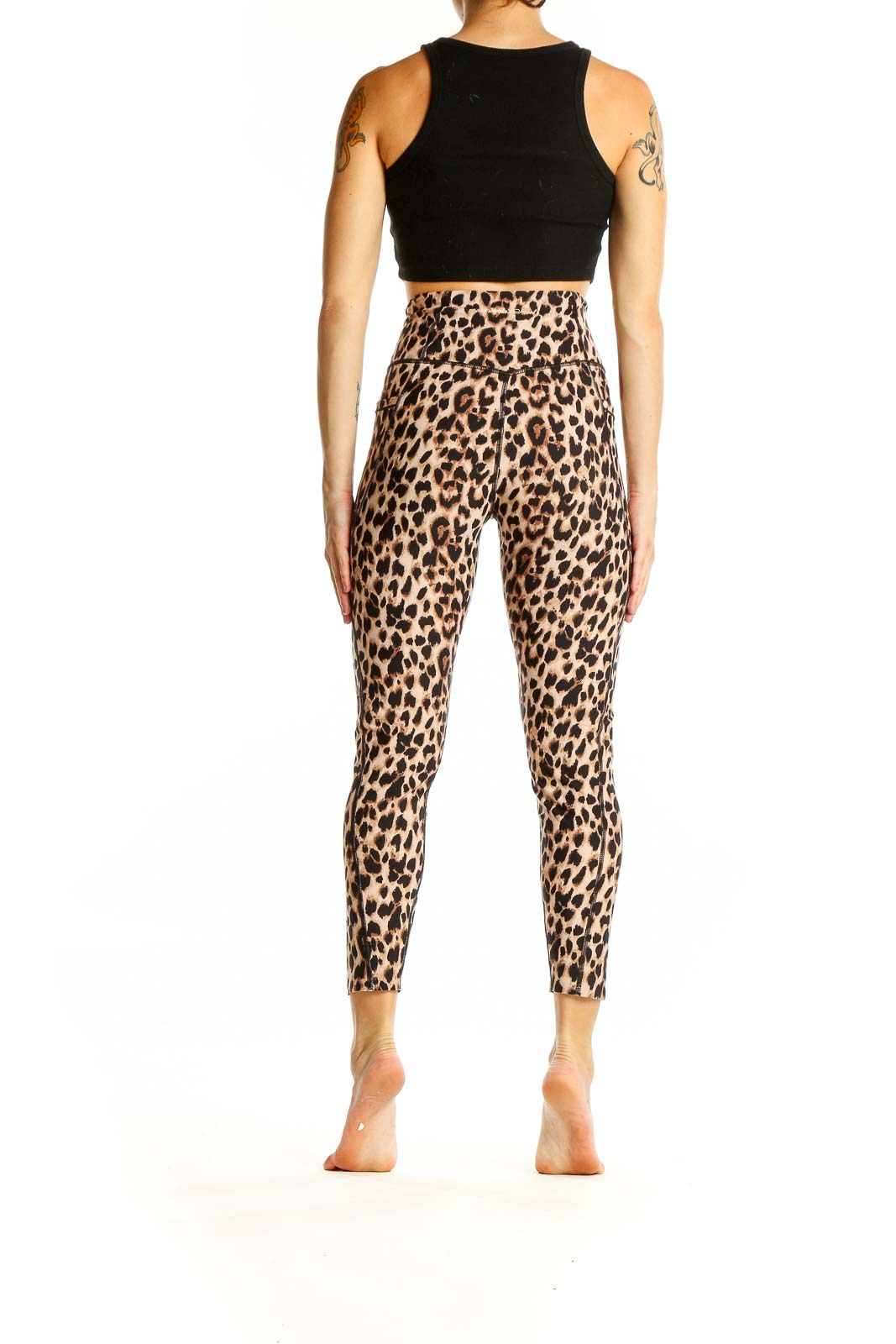 Back view of Victoria's Secret leopard print high-waisted activewear leggings on model