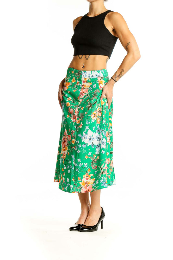 Front view of LOFT green floral midi skirt with A-line silhouette