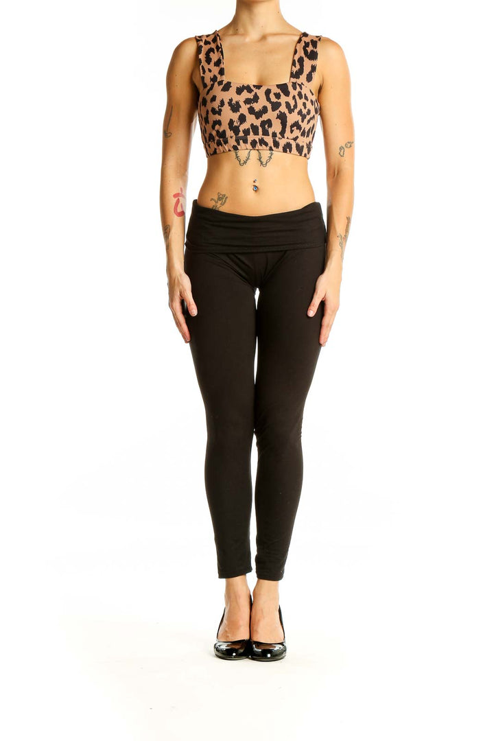 Front view of All Fenix leopard print crop top on model