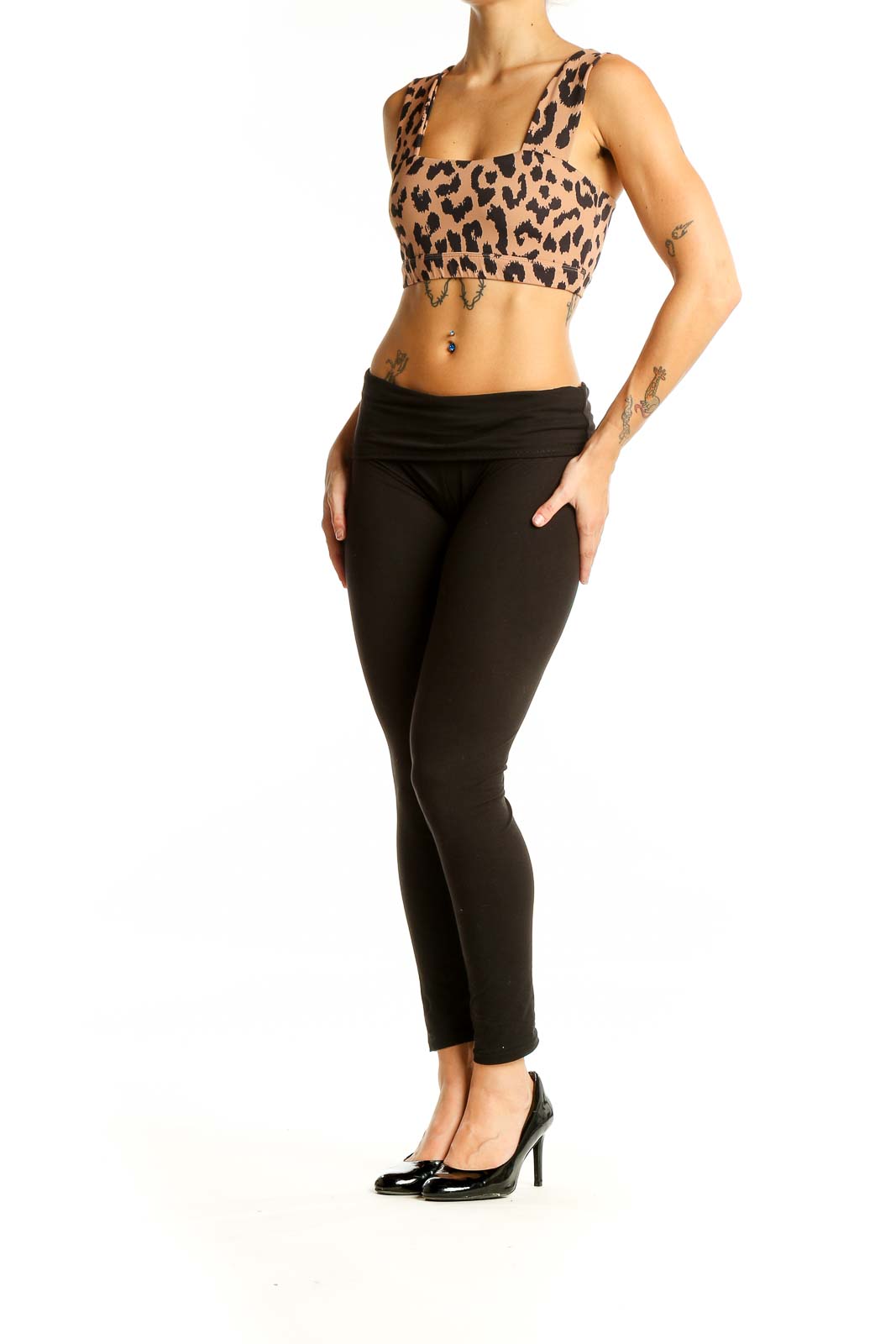 Front view of All Fenix leopard print crop top on model