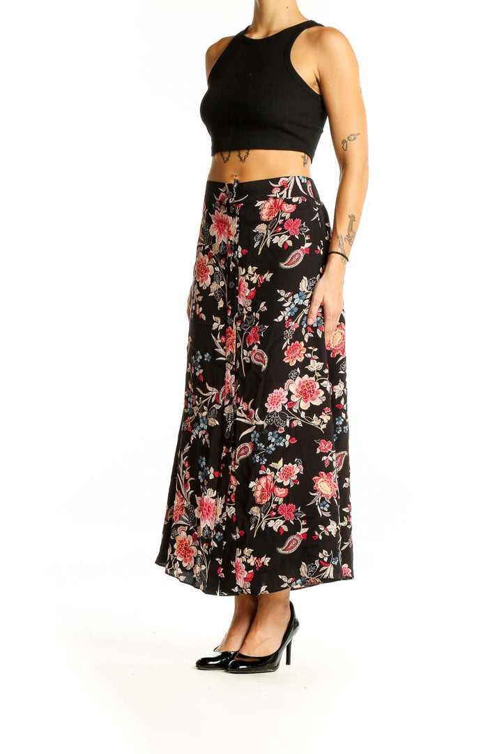 Front view of LOFT black floral maxi skirt with pink and red flowers