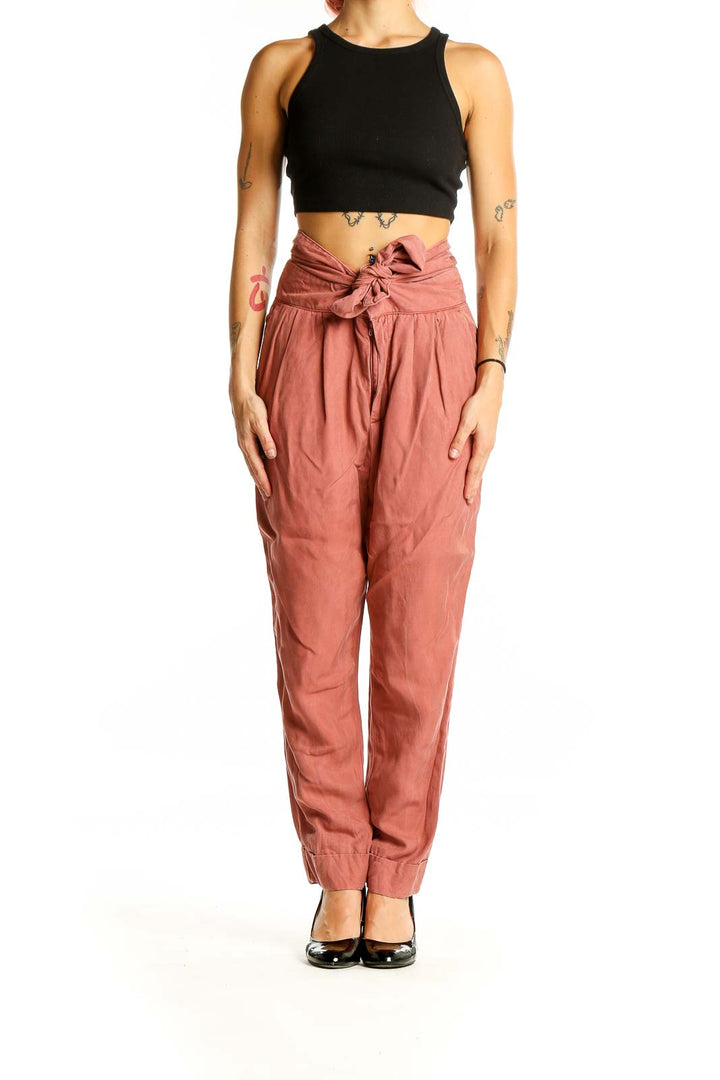 Front view of Cartonnier terracotta high-waisted pants with tie-front detail