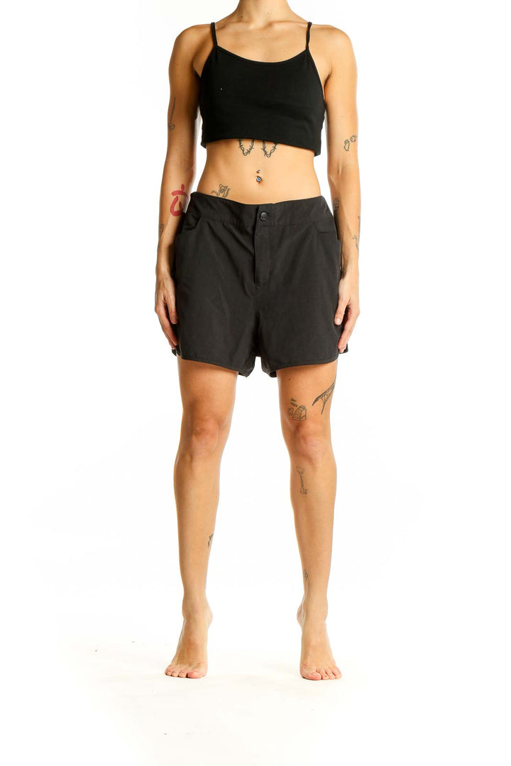 Front view of black Magellan Outdoors athletic shorts with side pockets