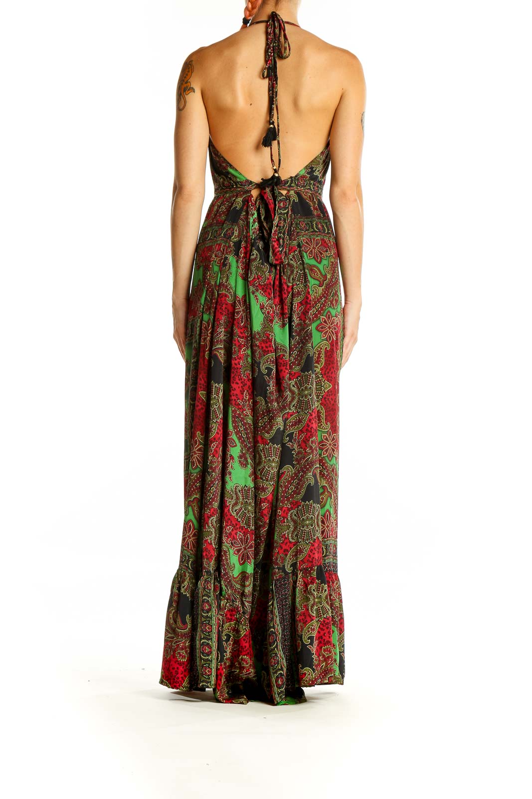 Back view of green paisley halter maxi dress showing open back with tie closure