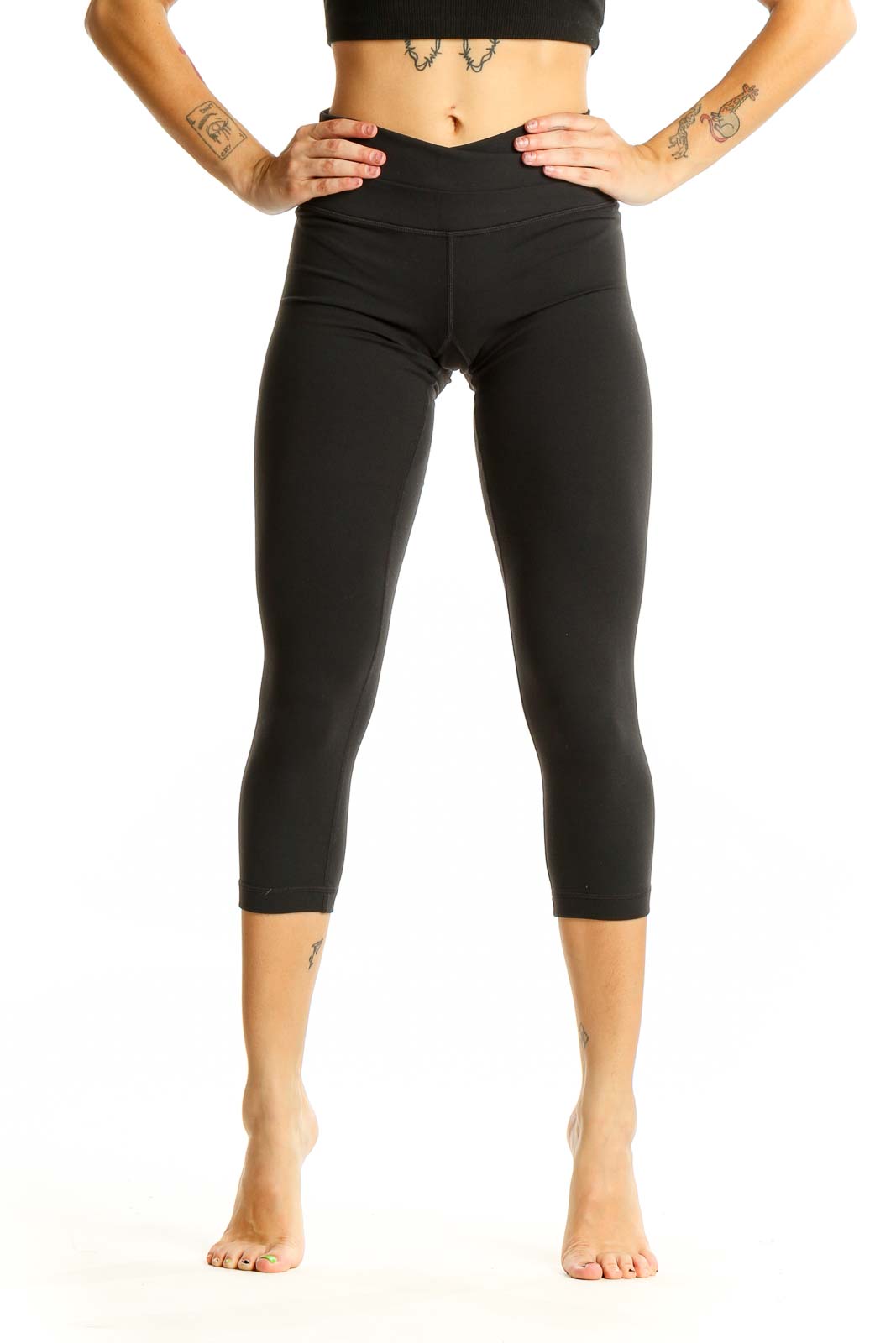 Front view of black Lululemon high-waisted cropped activewear leggings