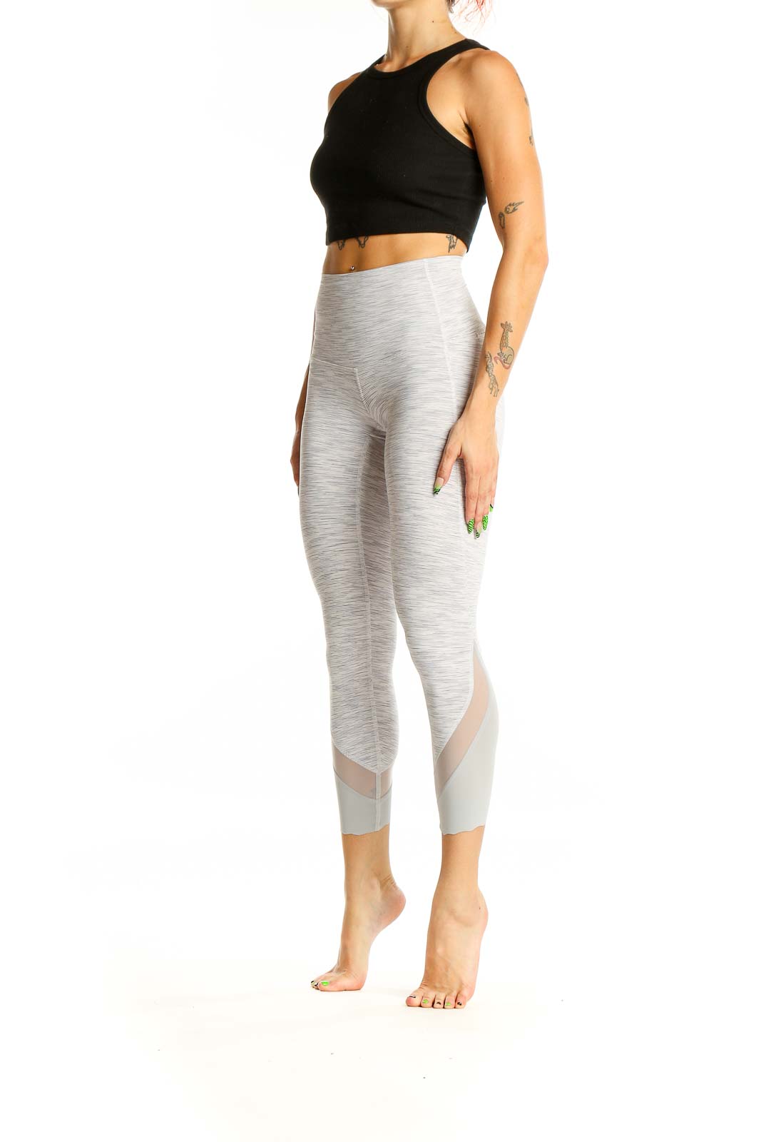 Front view of Lululemon light gray high-waisted cropped leggings with mesh inserts