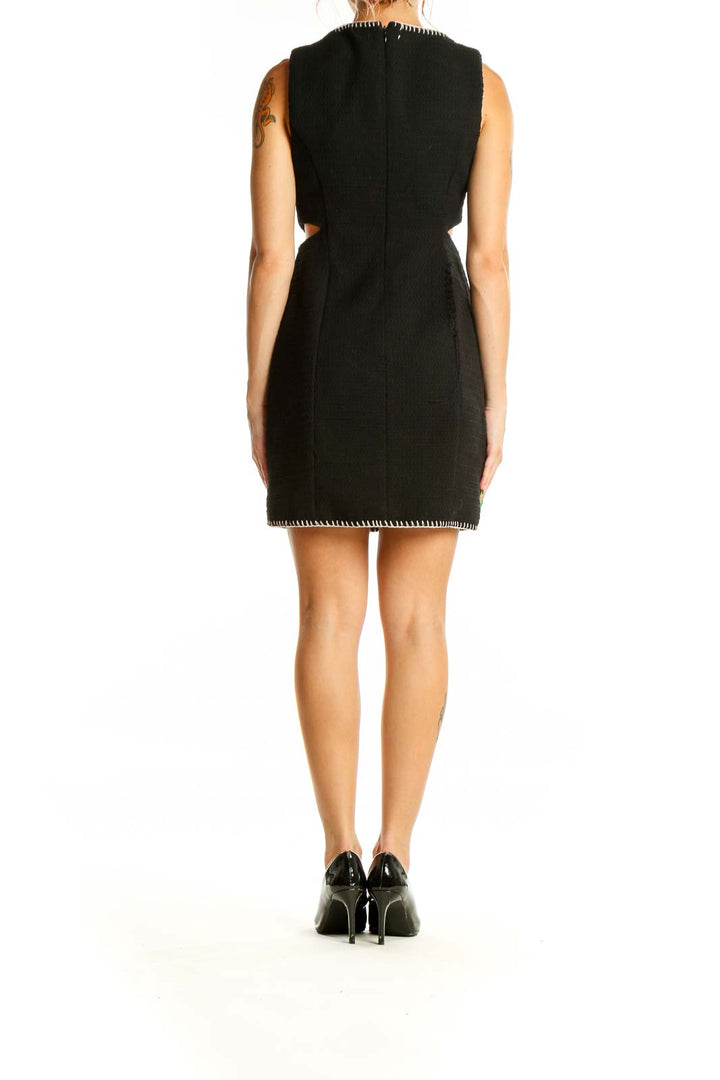 Back view of 7 For All Mankind black textured mini dress showing cutout details