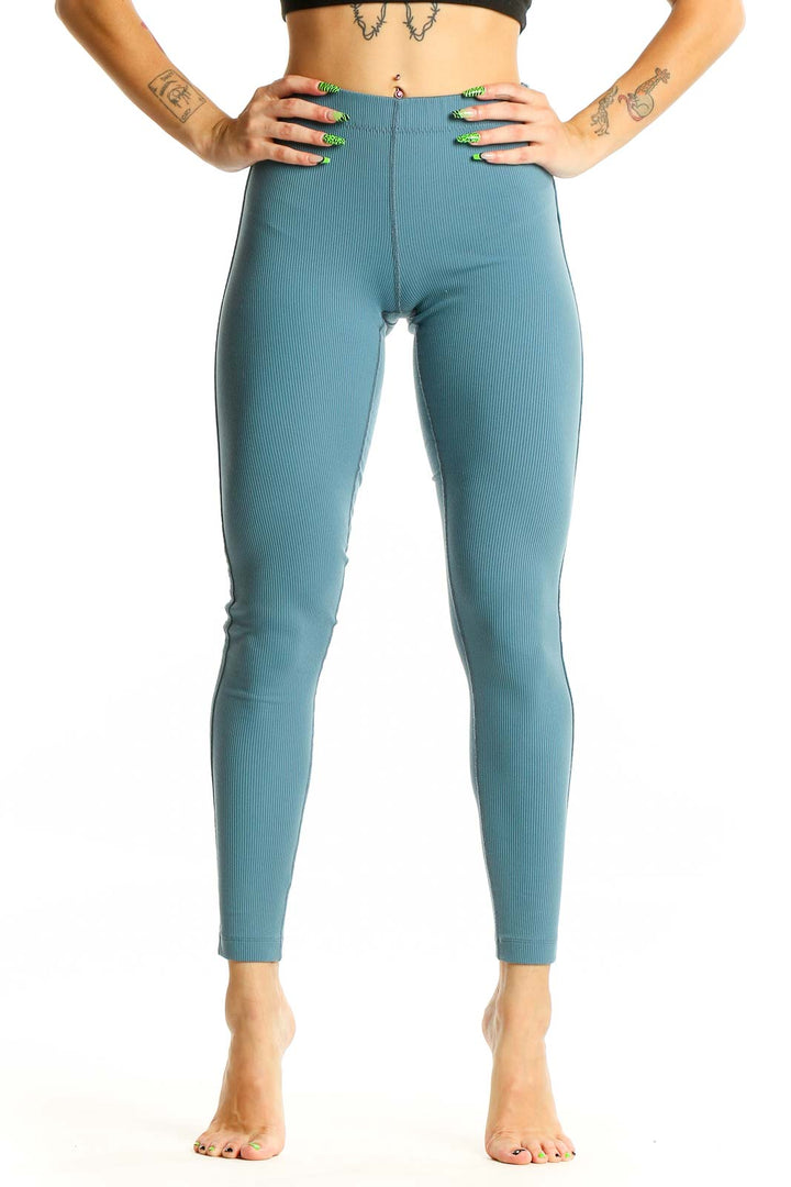 Front view of teal high-waisted ribbed leggings from Outdoor Voices