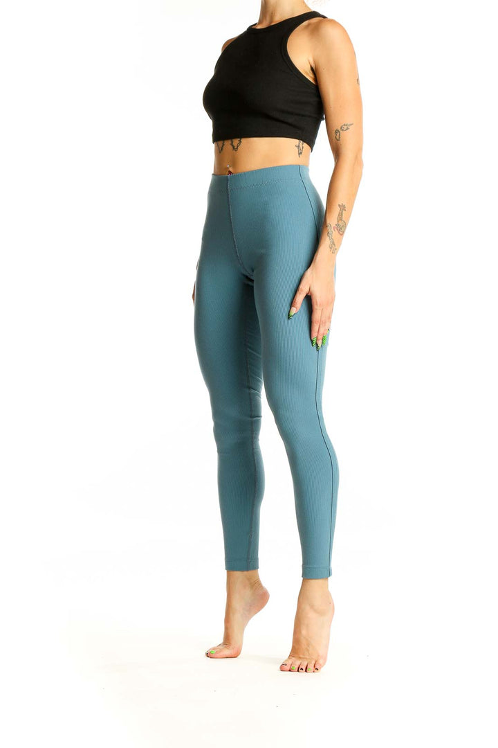 Front view of teal high-waisted ribbed leggings from Outdoor Voices