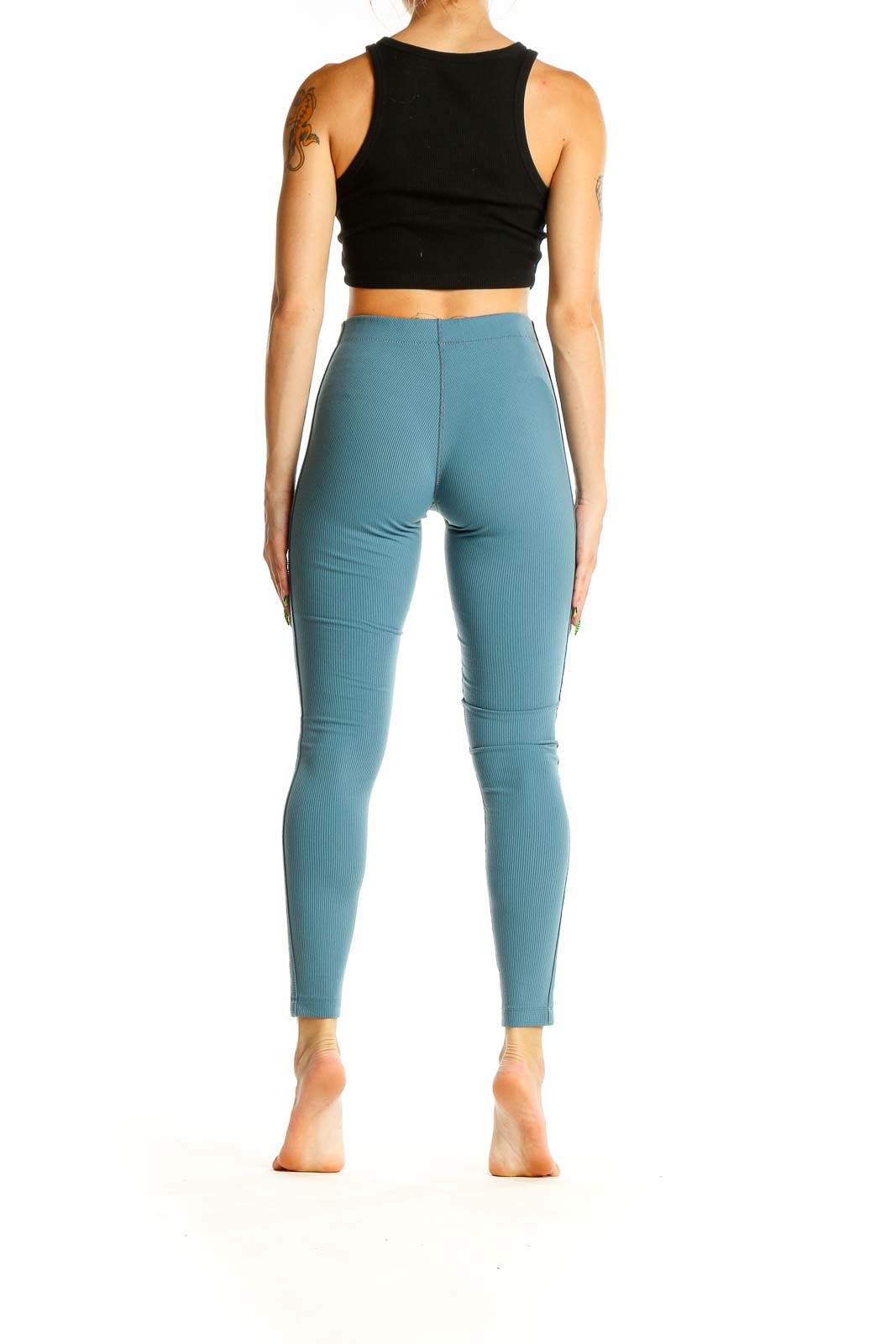 Back view of teal high-waisted ribbed leggings from Outdoor Voices