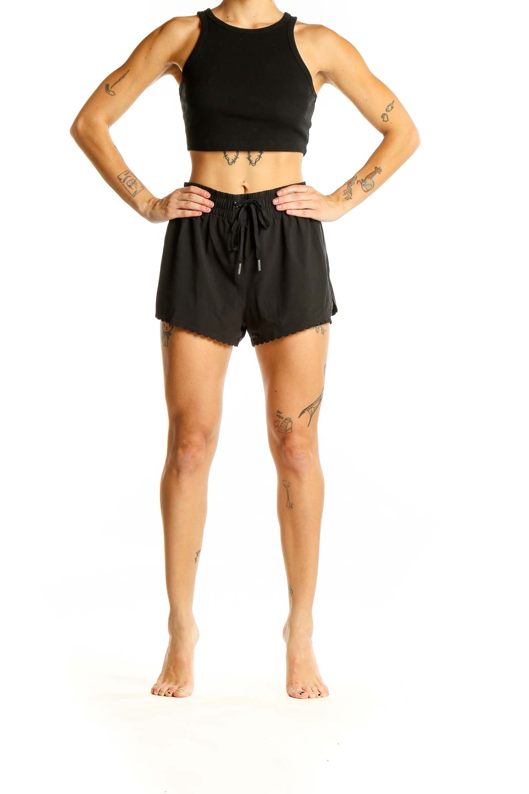 Front view of black Victoria Sport athletic shorts with scalloped edges