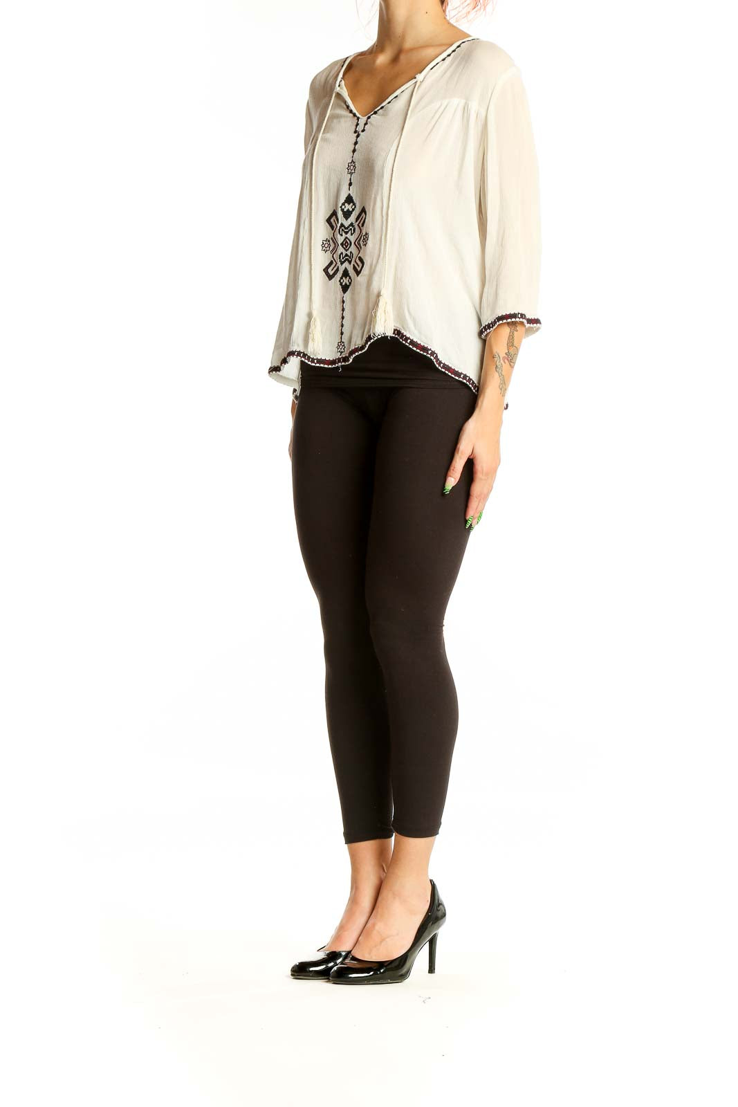 Front view of white embroidered rayon peasant top by Collective Concepts