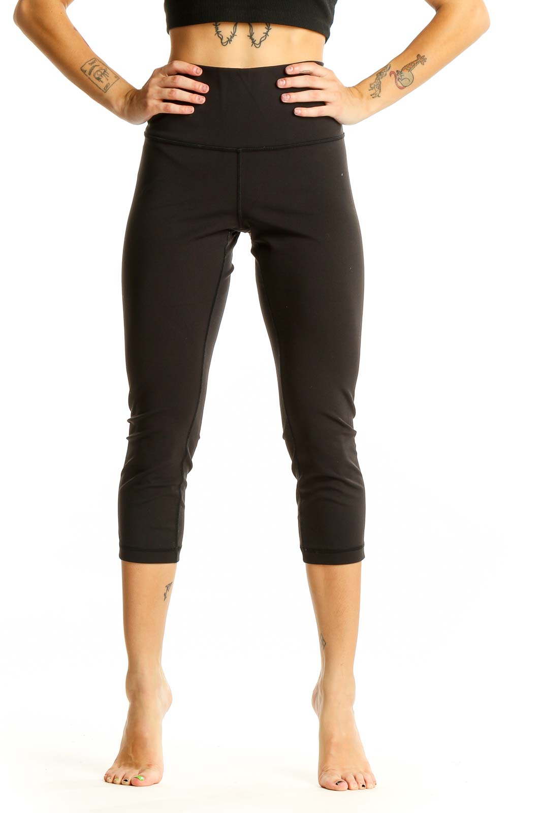 Front view of black Lululemon high-waisted capri leggings