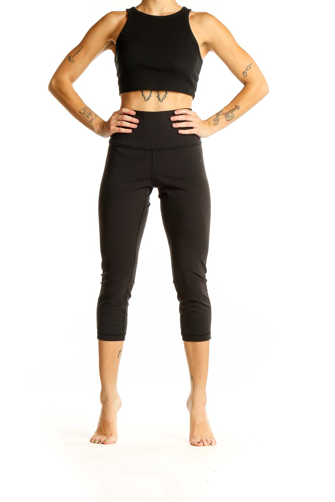 Front view of black Lululemon high-waisted capri leggings