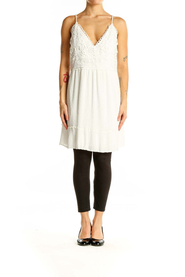 Front view of white lace trim rayon sundress with V-neckline