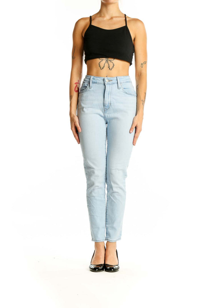 Front view of Levi's light blue high-waisted slim fit jeans on model