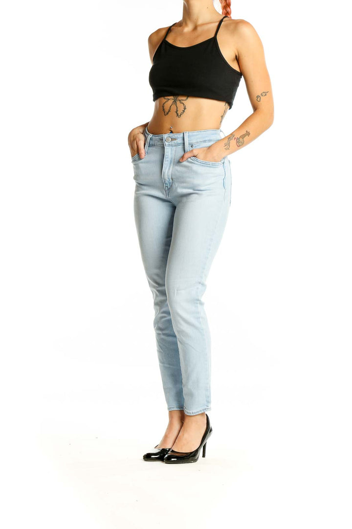 Front view of Levi's light blue high-waisted slim fit jeans on model