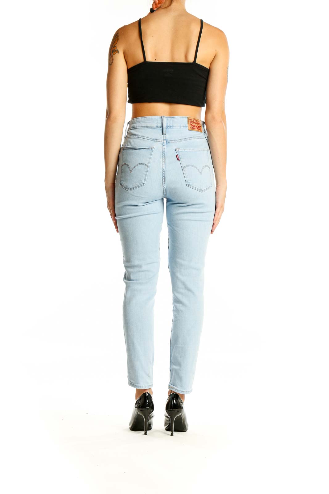 Back view of Levi's light blue high-waisted slim fit jeans showing signature pocket stitching