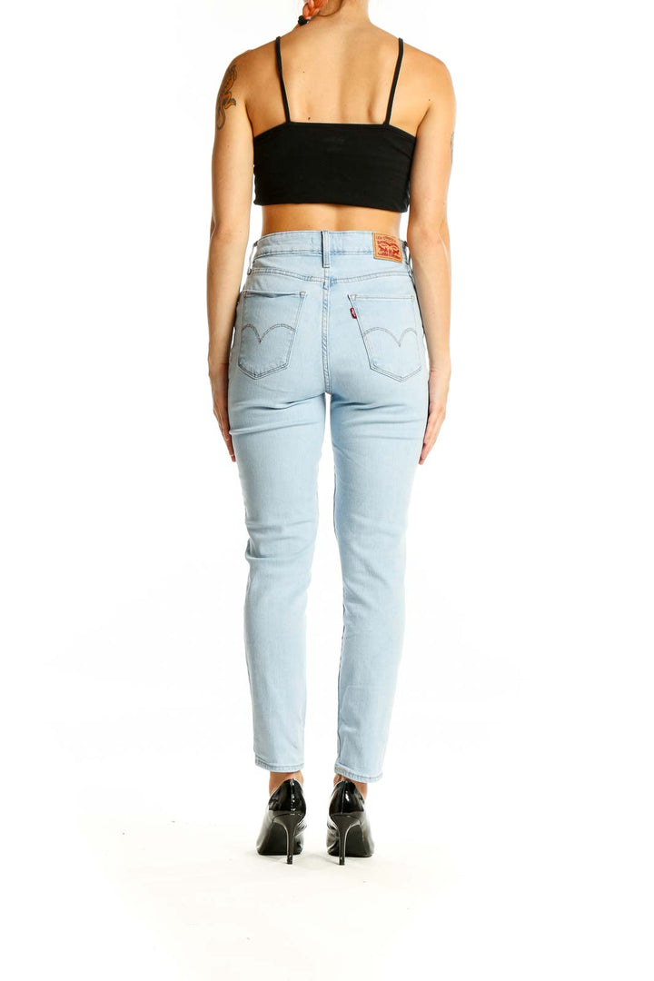 Back view of Levi's light blue high-waisted slim fit jeans showing signature pocket stitching