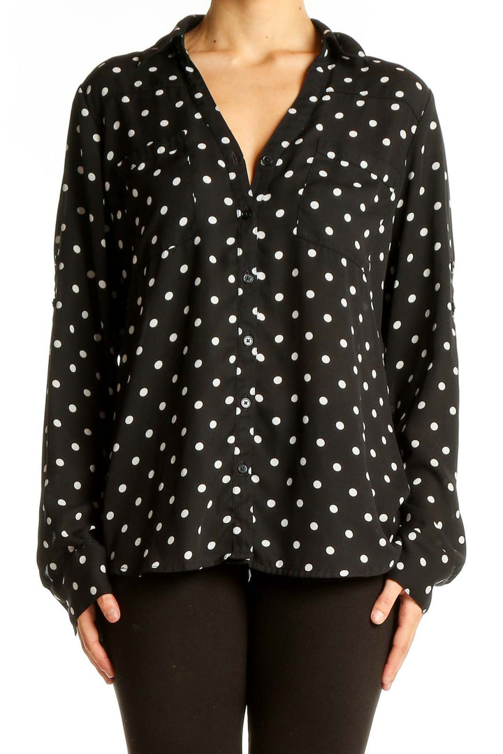 Front view of Express black polka dot button-up blouse