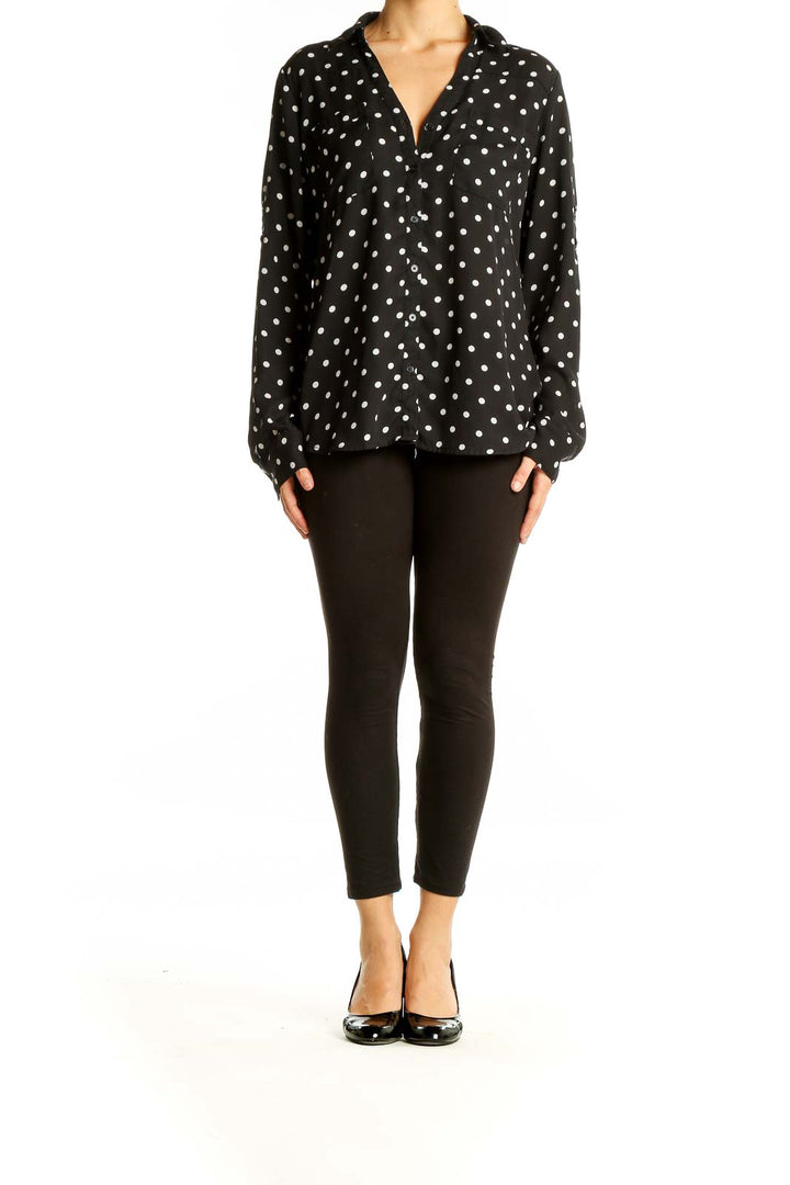 Front view of Express black polka dot button-up blouse