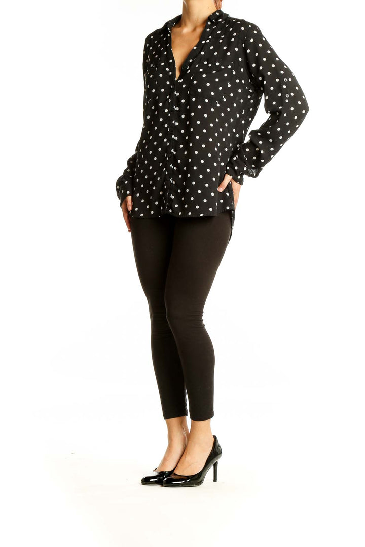 Front view of Express black polka dot button-up blouse