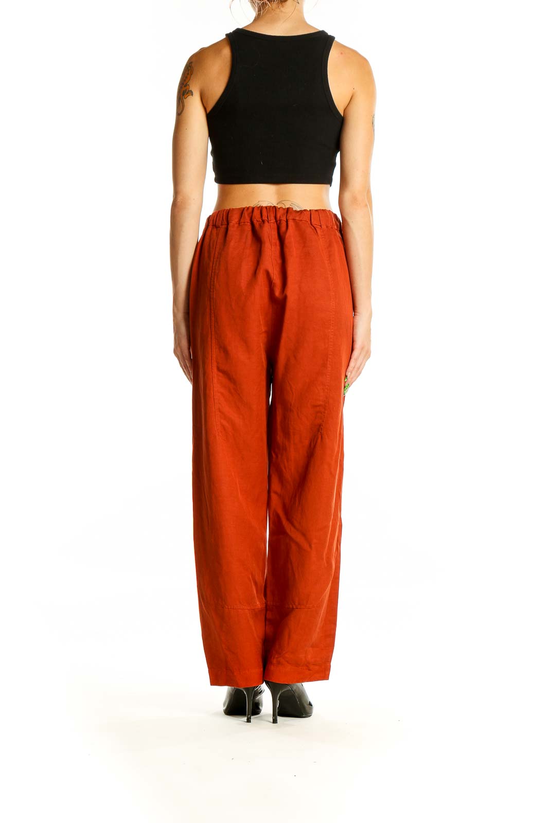 Back view of Eileen Fisher rust linen blend wide-leg pants on model