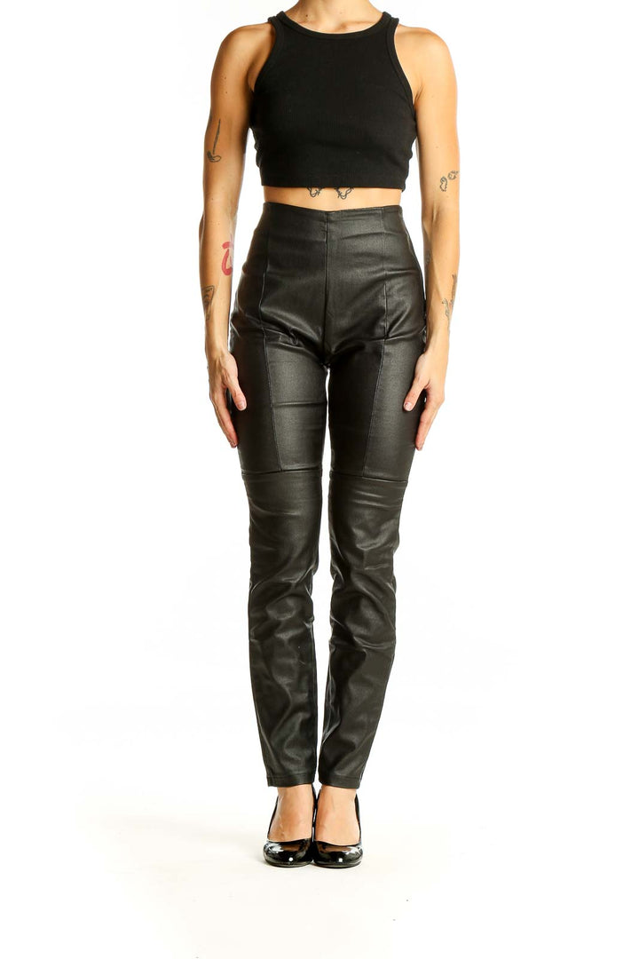 Front view of black faux leather high-waisted skinny pants