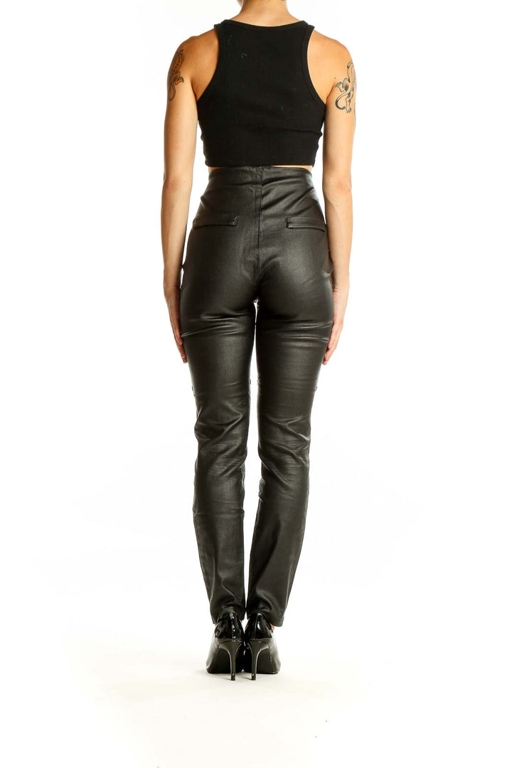 Back view of black faux leather high-waisted skinny pants