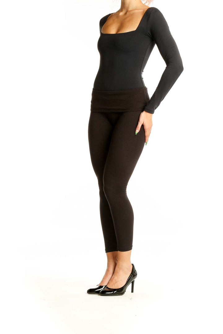 Front view of black Aritzia bodysuit with square neckline