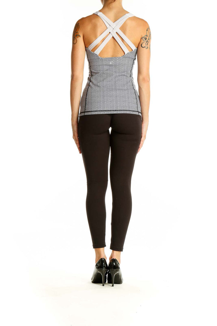 Back view of Lululemon black and white mesh athletic tank top with cross-back design