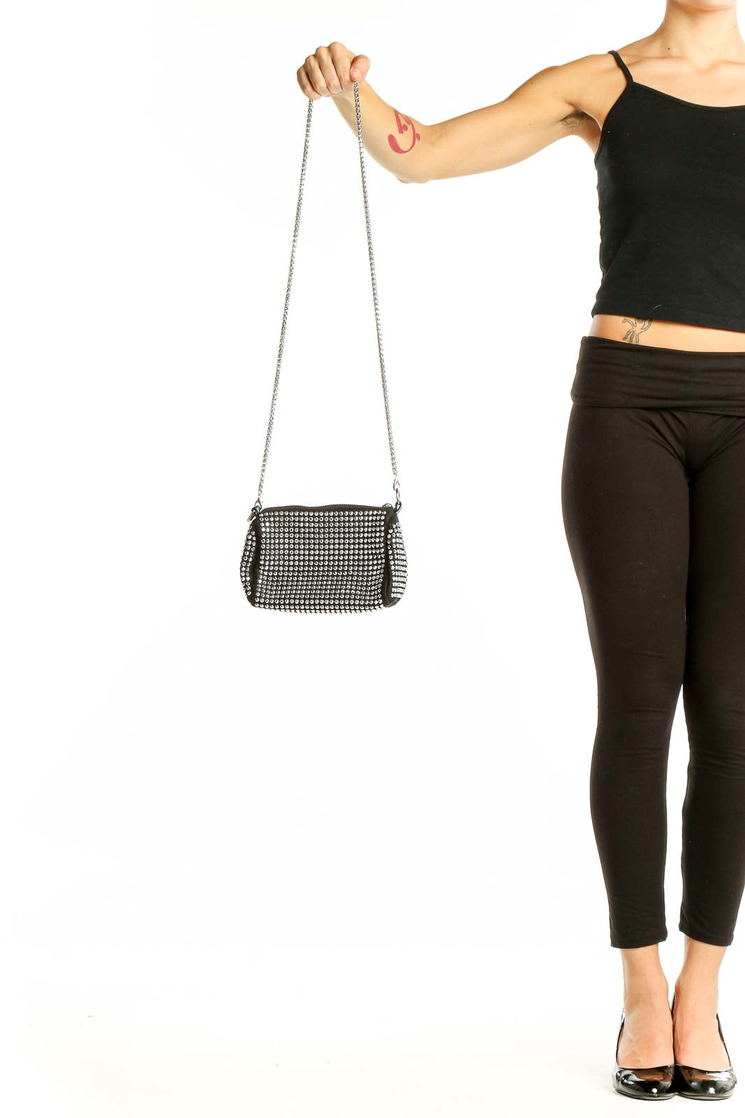 Front view of SilkRoll black studded crossbody bag with chain strap