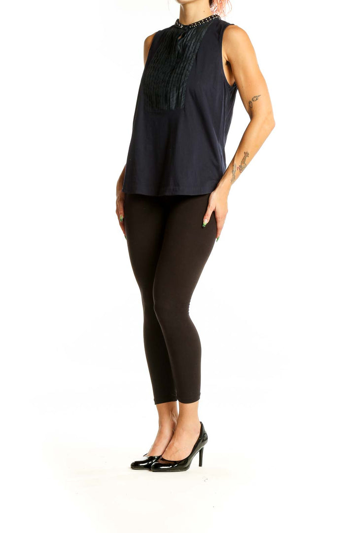 Front view of J.Crew black sleeveless top with embellished collar and pleated bib front