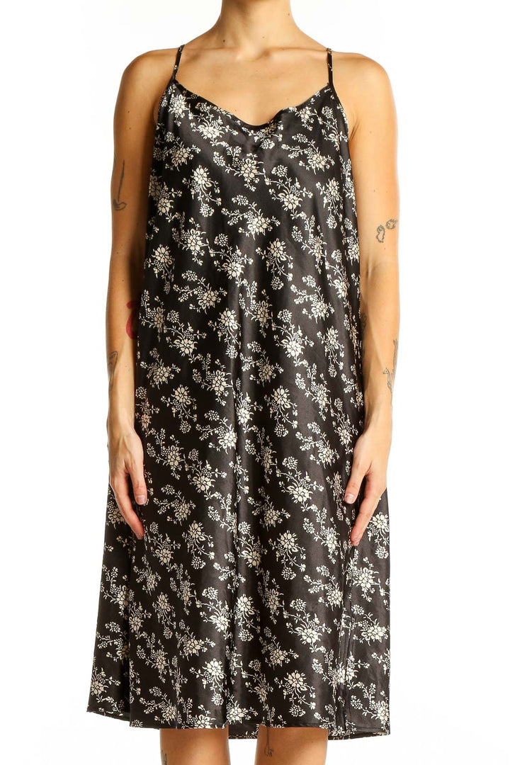 Front view of SilkRoll black floral print slip dress with V-neck and thin straps