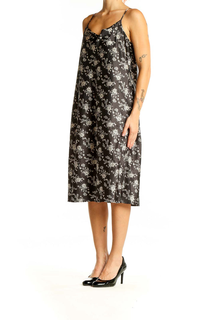 Front view of SilkRoll black floral print slip dress with V-neck and thin straps