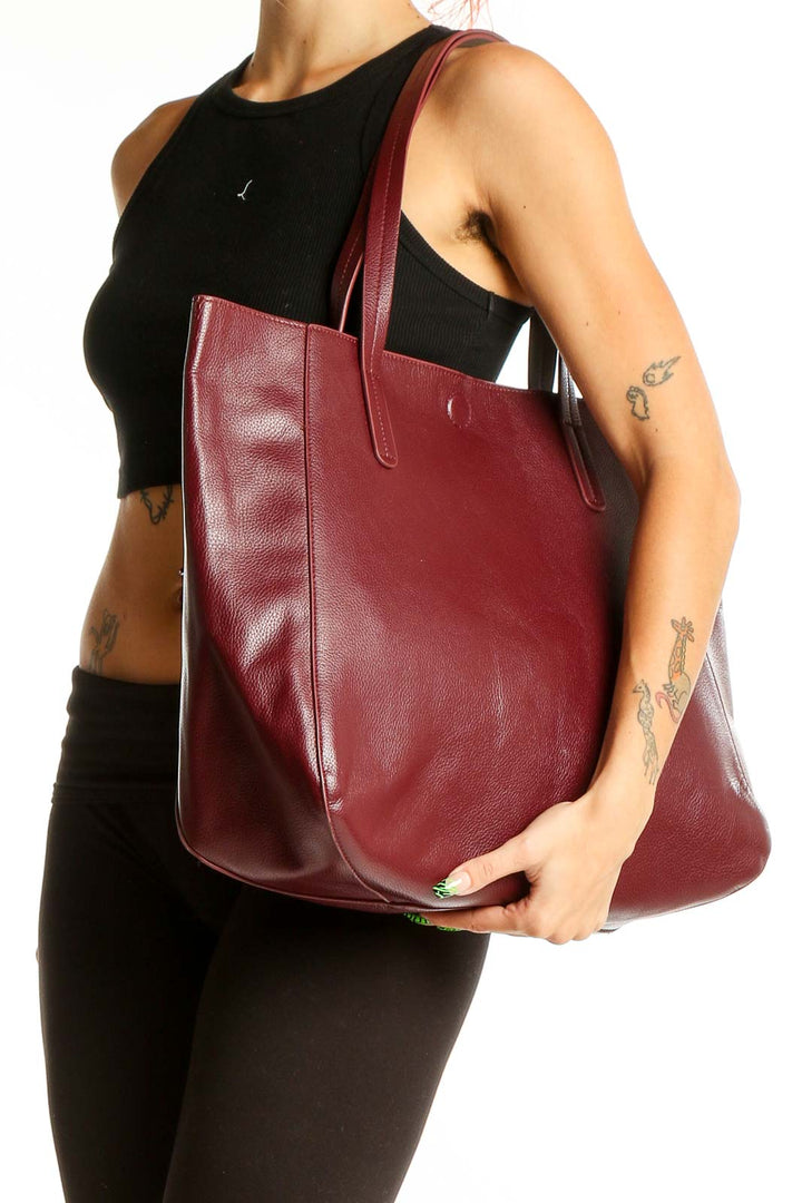 Front view of burgundy leather tote bag by SilkRoll