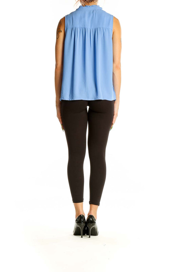 Back view of J.Crew blue sleeveless blouse showing gathered yoke