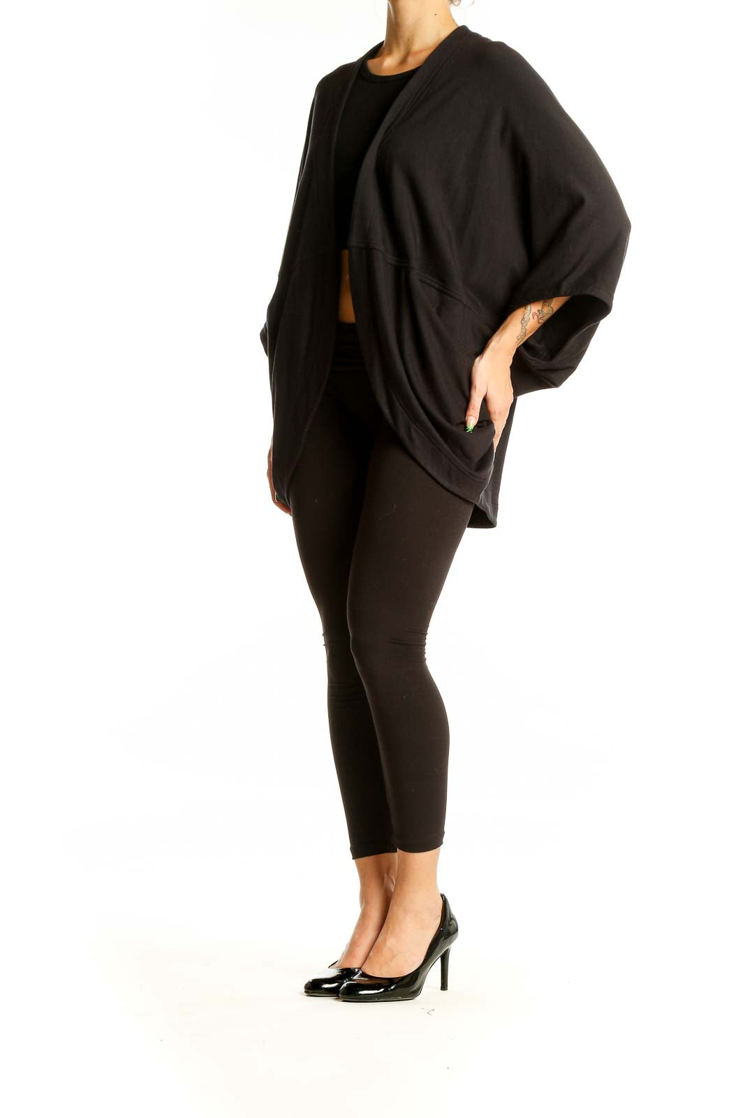 Front view of black Athleta knit cardigan with flowy silhouette and kimono sleeves