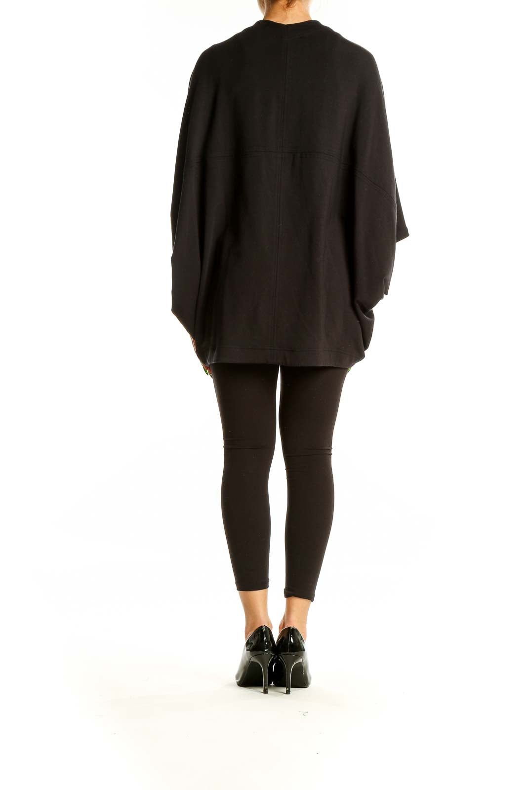 Back view of black Athleta knit cardigan showing full length and drape