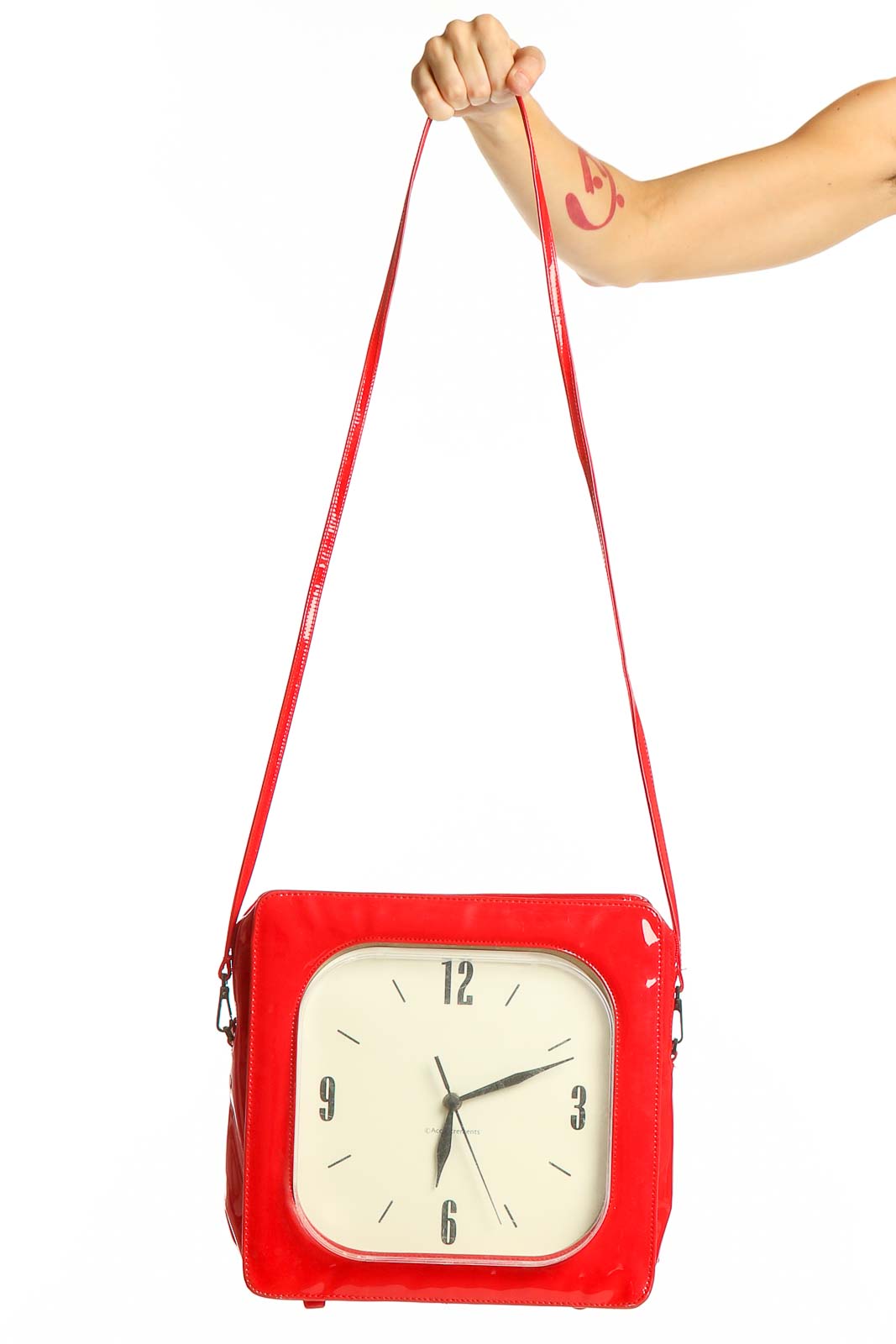 Front view of SilkRoll red clock-inspired crossbody bag