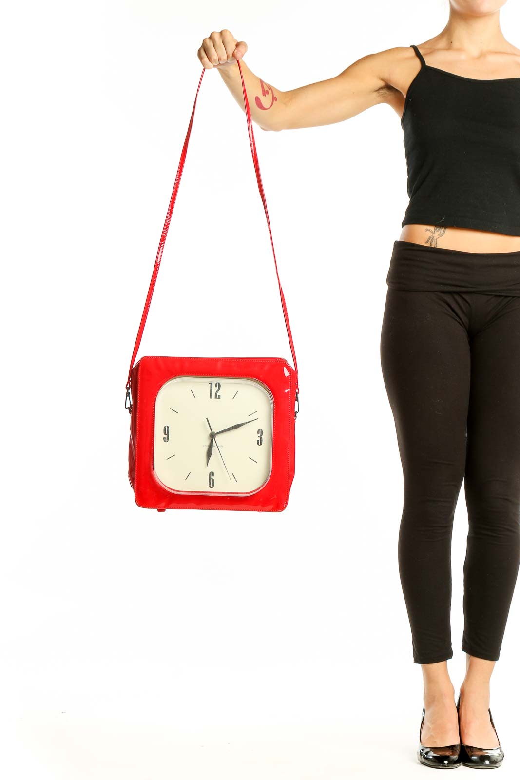 Front view of SilkRoll red clock-inspired crossbody bag