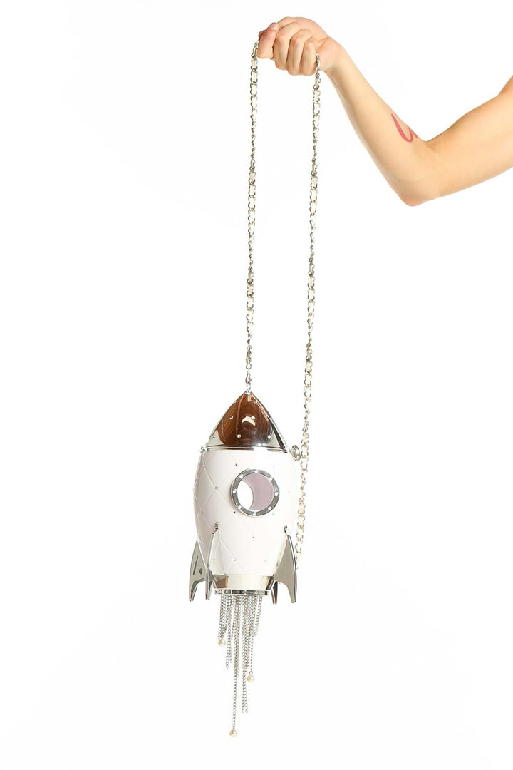 White rocket ship crossbody bag with silver chain strap