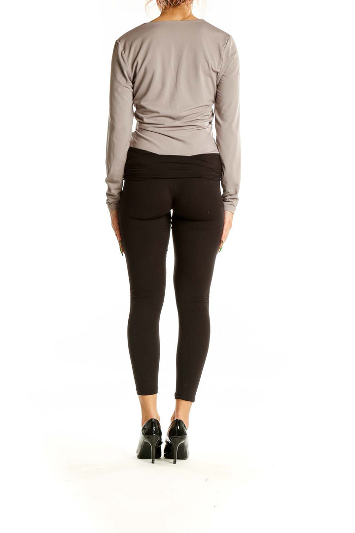 Back view of Abercrombie & Fitch gray wrap-style long sleeve top with black leggings