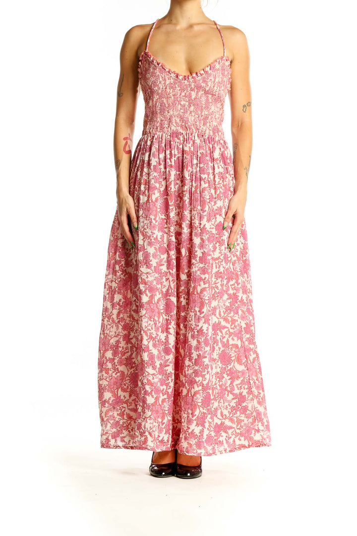 Front view of Free People pink floral maxi dress with smocked bodice