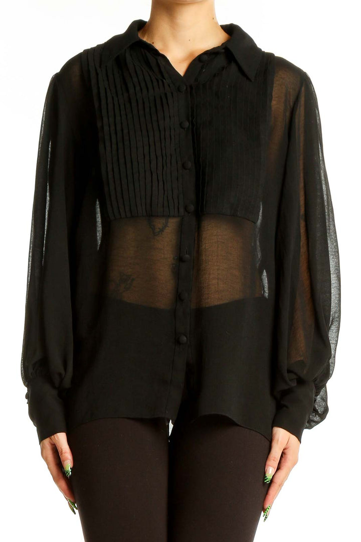 Front view of Zara black sheer blouse with pleated bib front and button-up design