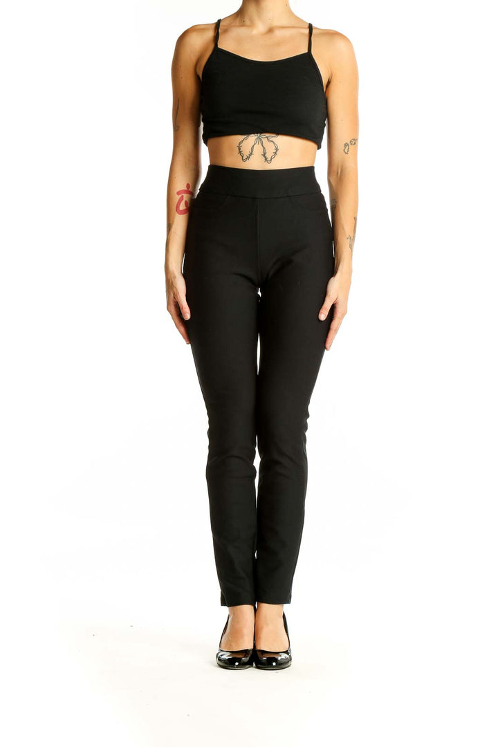 Front view of HONEYLOVE black high-waisted slim fit pants on model