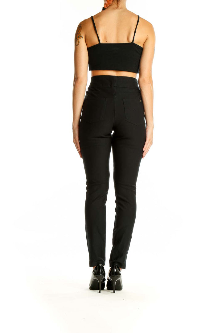 Back view of HONEYLOVE black high-waisted slim fit pants on model