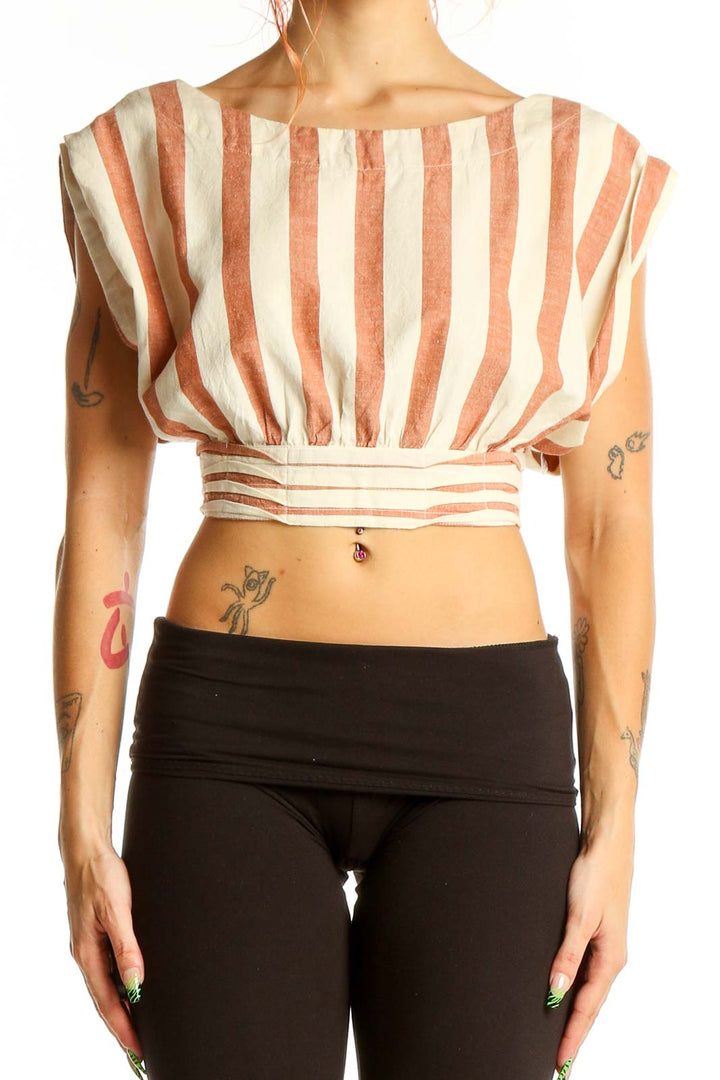 Front view of Free People peach striped crop top with gathered waist