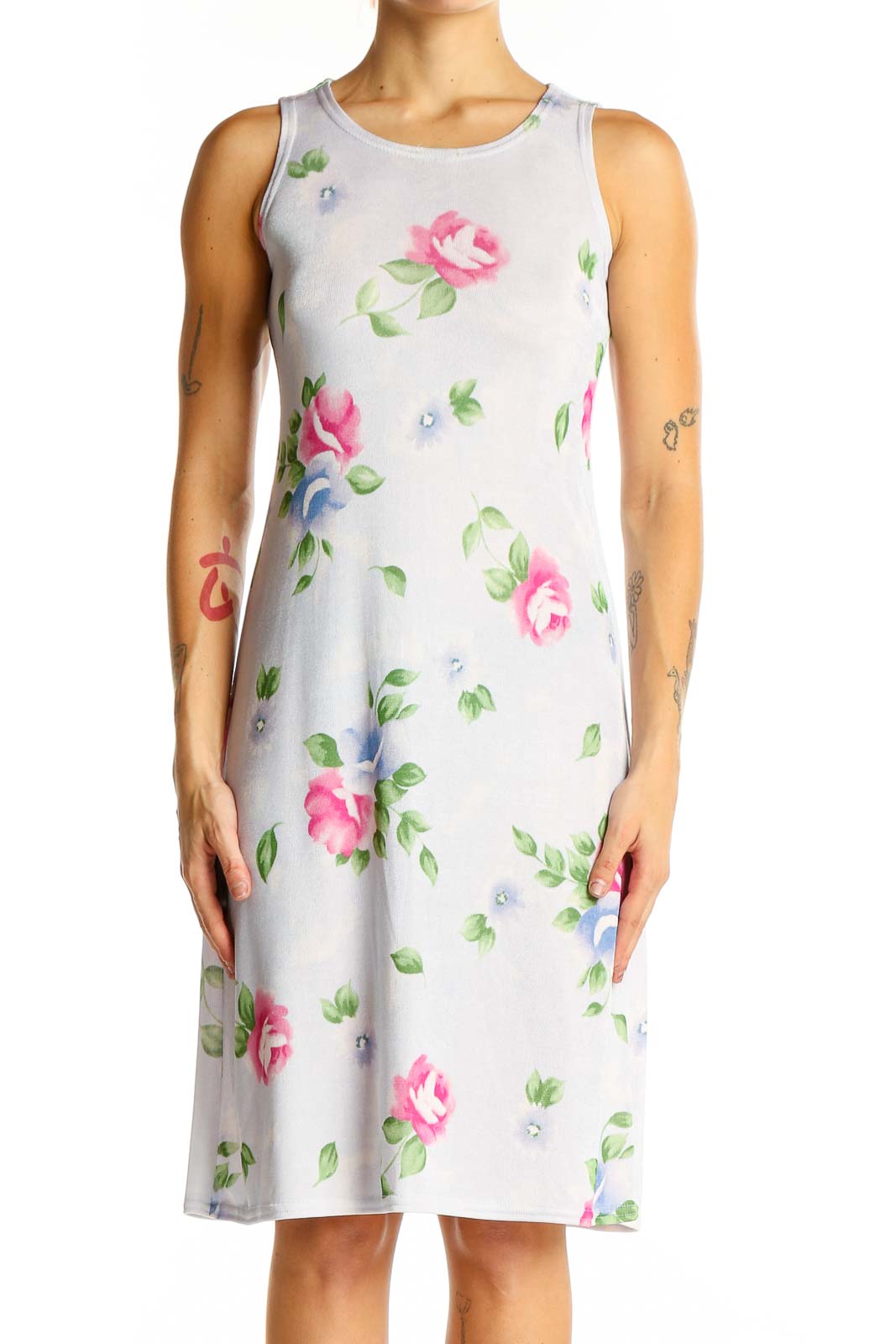 Front view of white sleeveless midi dress with pink and blue floral print