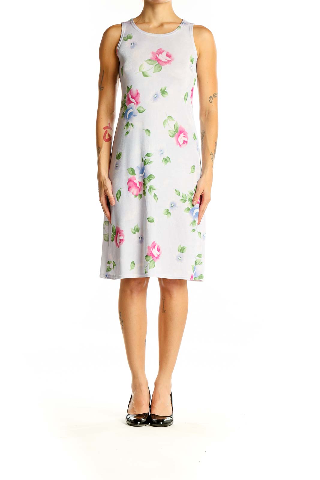 Front view of white sleeveless midi dress with pink and blue floral print